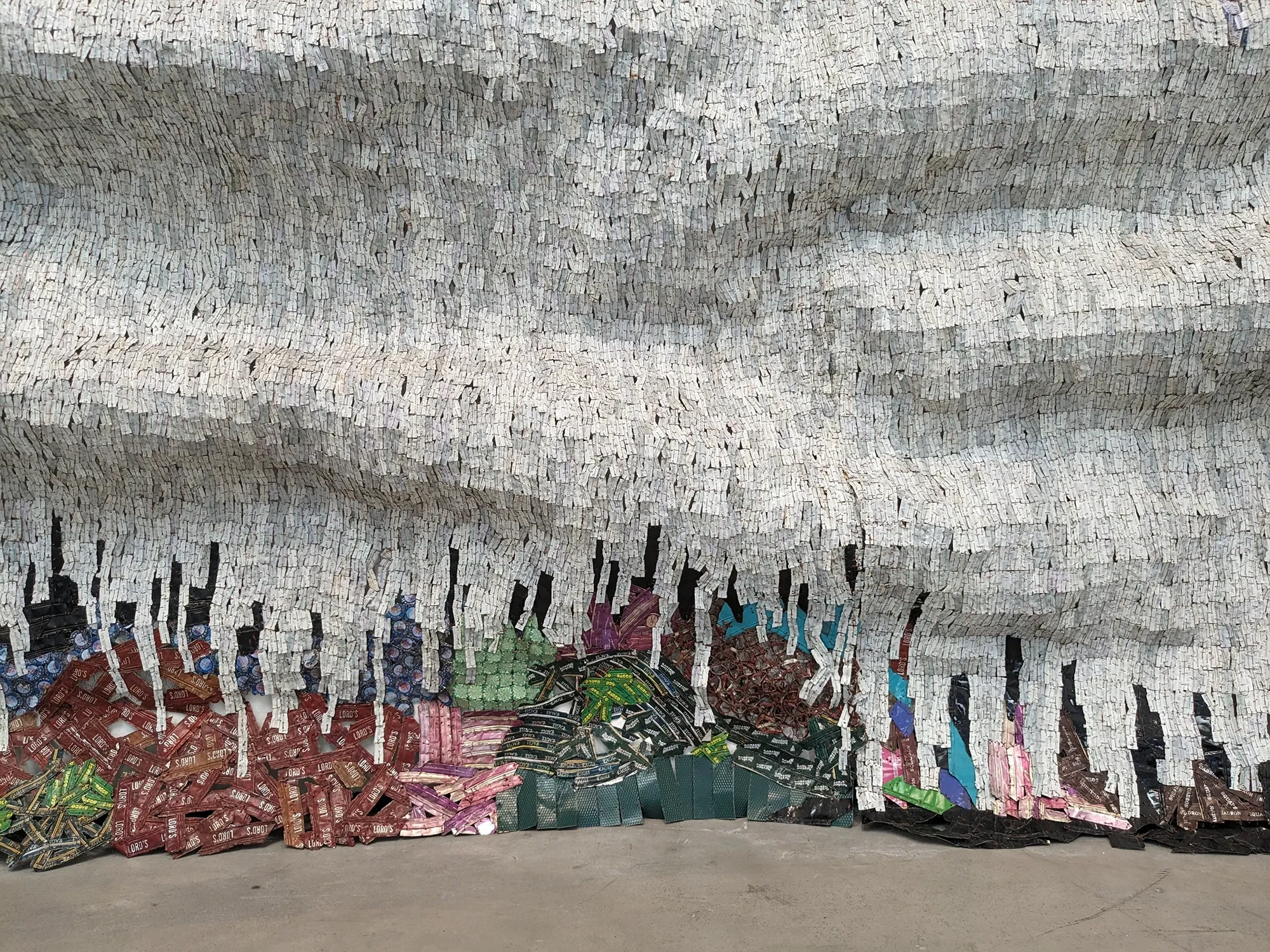 el anatsui famous contemporary artist and sculpture in installation art from Ghana on view in Guggenheim Museum Bilbao, tapestry-like recycled materials munchies art club magazine