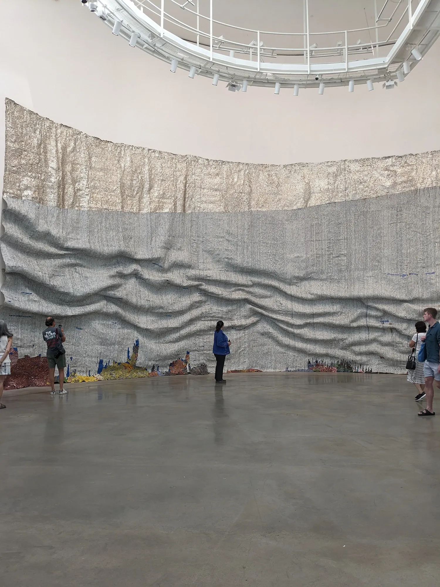 el anatsui famous contemporary artist and sculpture in installation art from Ghana on view in Guggenheim Museum Bilbao, tapestry-like recycled materials munchies art club magazine