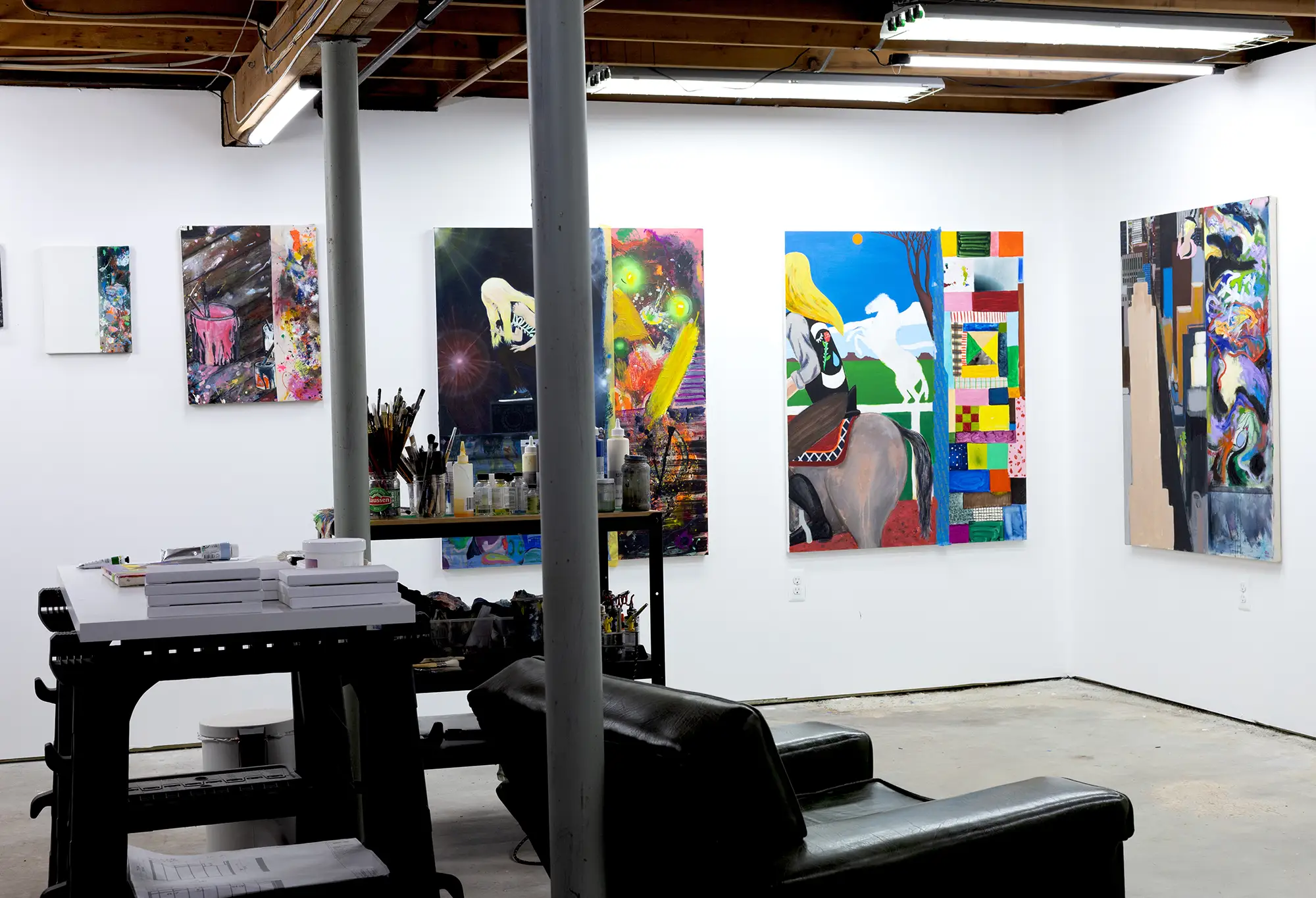 studio of brandon aguiar, full of contemporary paintings artworks, sketches, promising