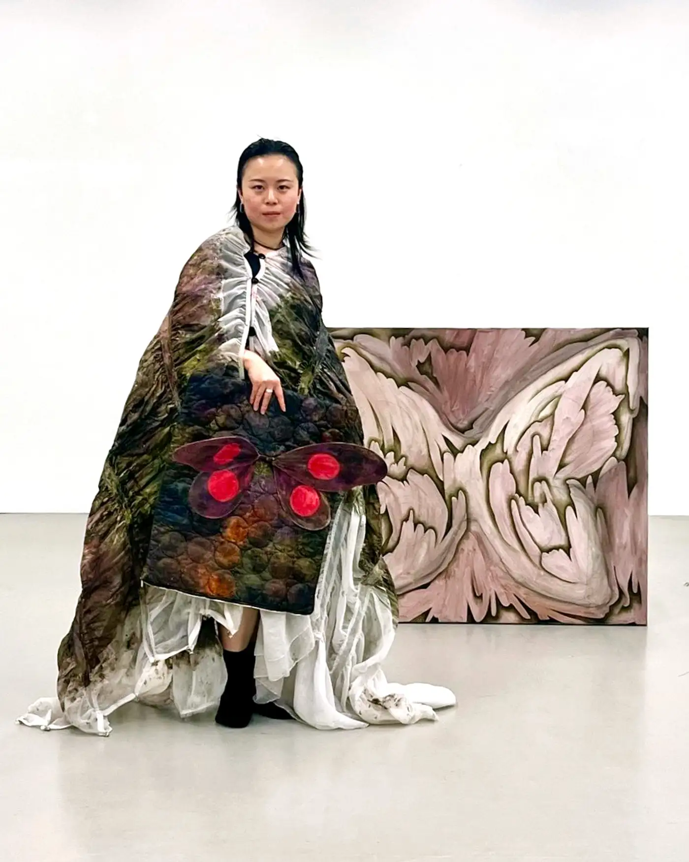 Close-up of embroidered costume used in Igigo Wu’s 'The Polychromatic Digital Forest in My Dreams', hand-painted textile details with organic and insect-like motifs