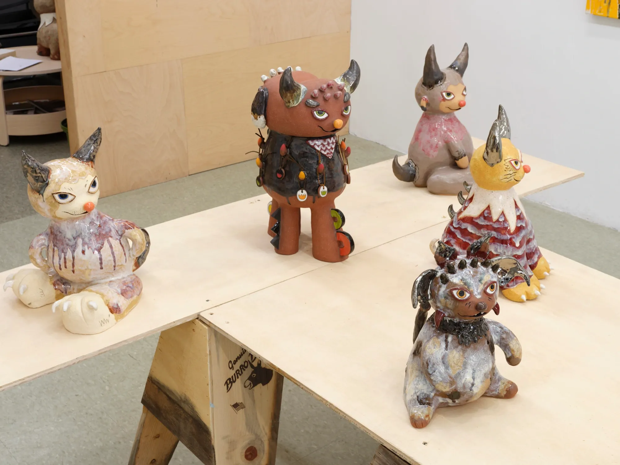 Close-up of ceramic creature with bright eyes and humorous expression, by Satoko Okuno