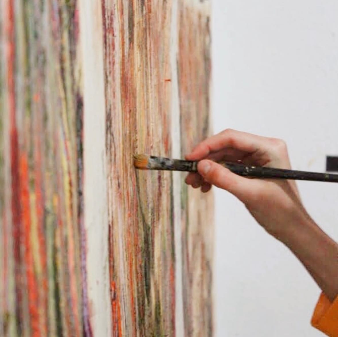 Detail of layered brushstrokes evoking vegetation and rainfall textures