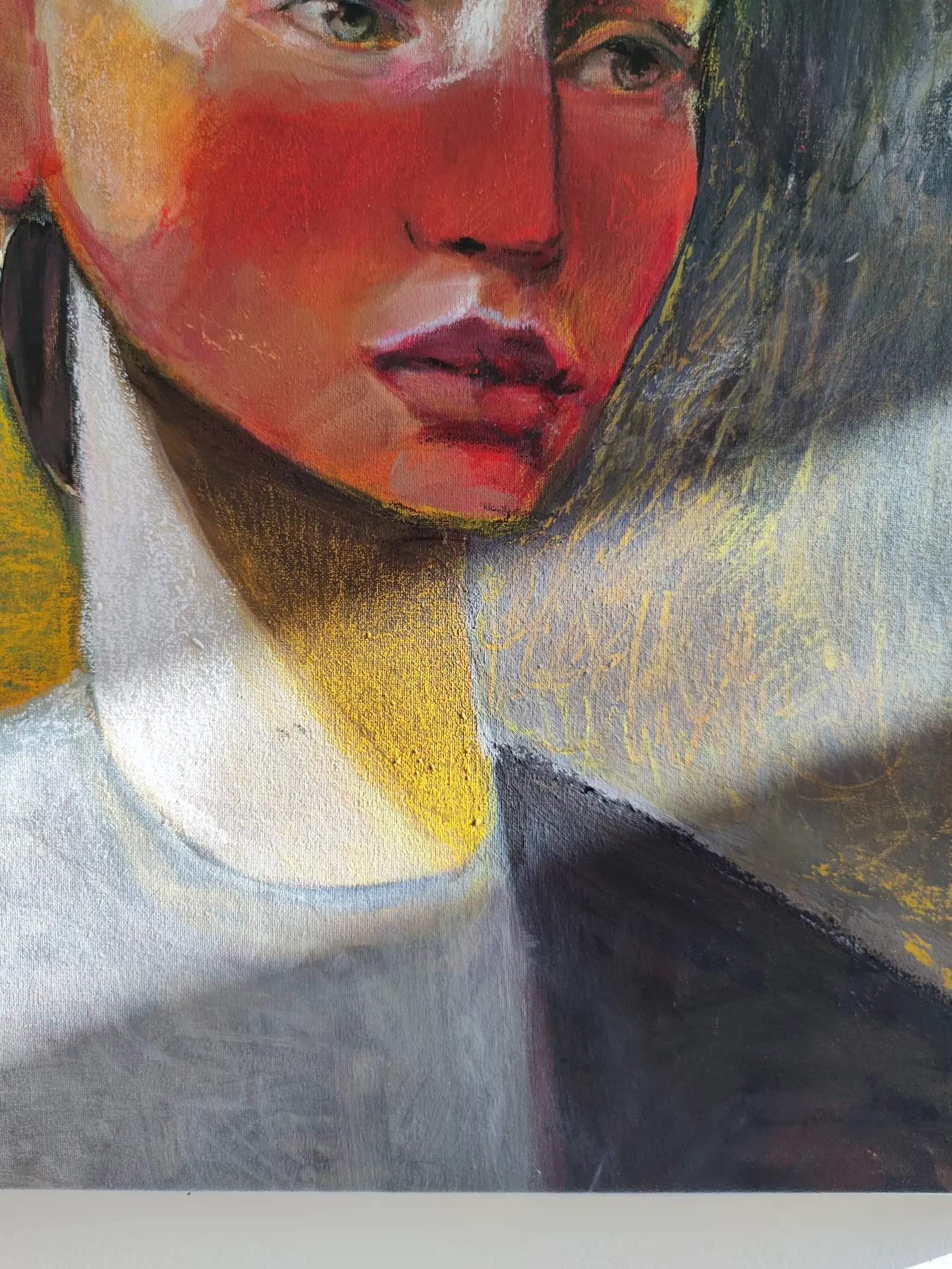 Close-up of a female portrait by Portuguese artist Margarida Fleming, captured in her Lisbon studio with natural sunlight revealing layered textures of acrylic and oil pastel on canvas.