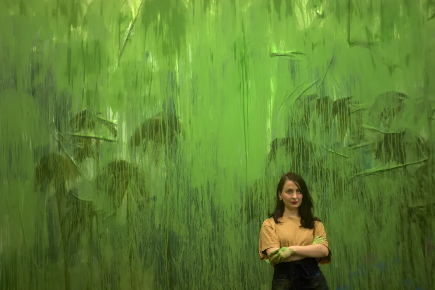 Mariam Akubardia portrait in front of large green painting.