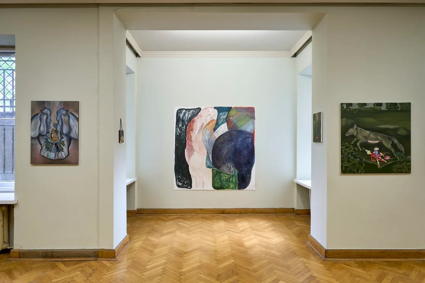 Mariam Akubardia exhibition view with multiple paintings in a white gallery room.