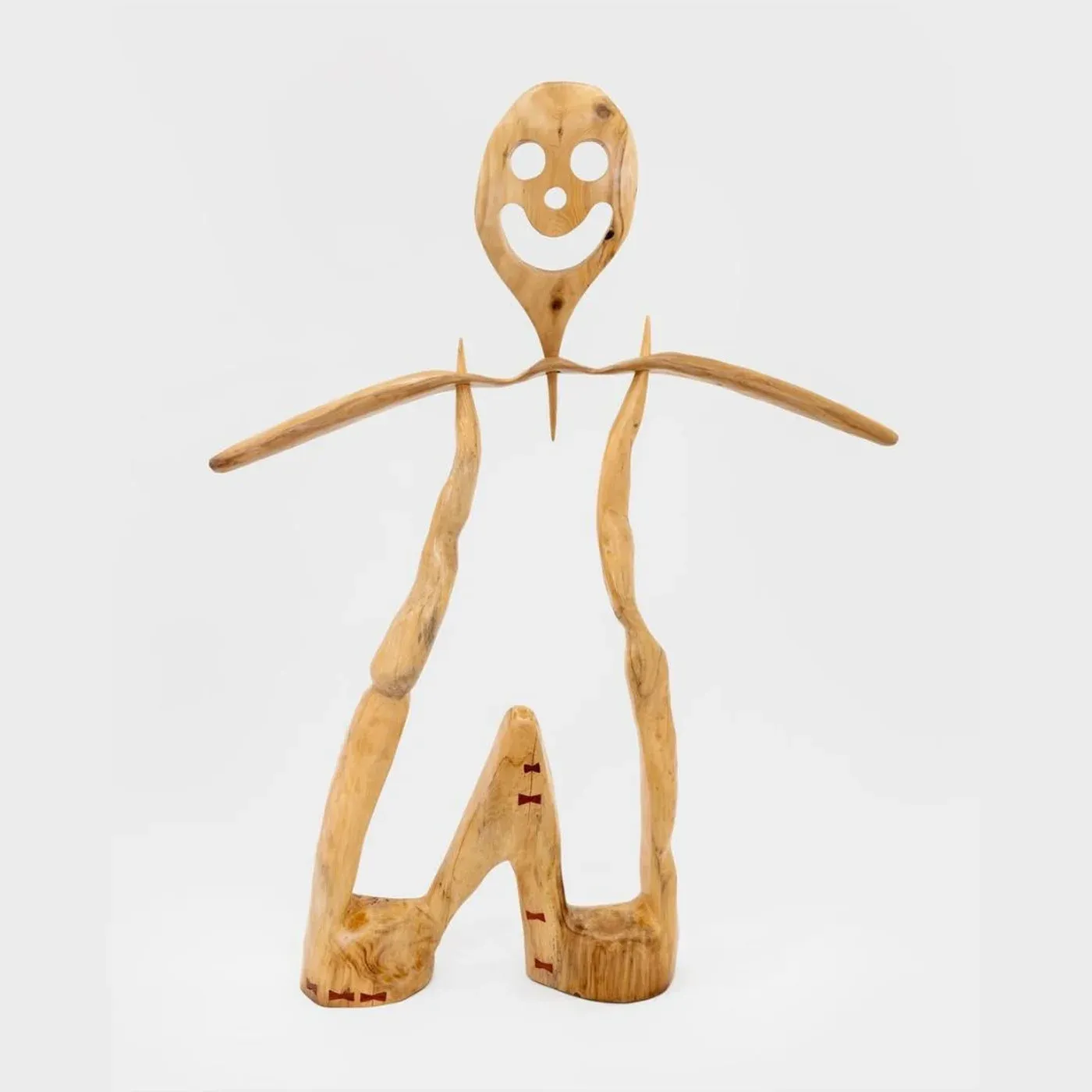 a wooden figure made out of pine wood reminds you of a figure out of a story from childhood