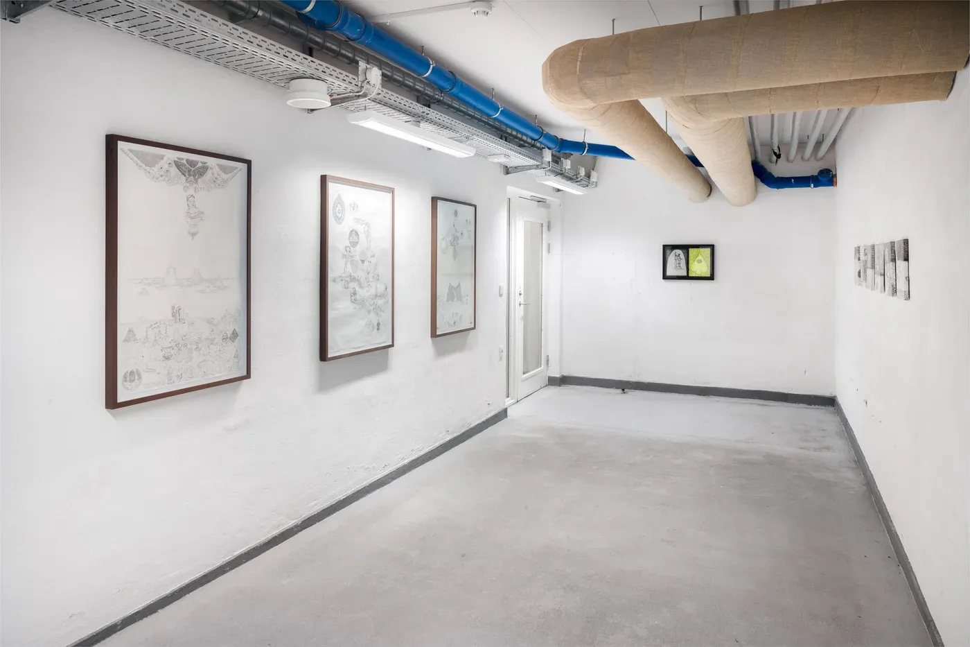  Stefan Bakmand: Corridor installation view with framed drawings and two neon works, “Dungeon Tongues,” Korridor, 2021. Photo Mikkel Kaldal. Image courtesy the artist.