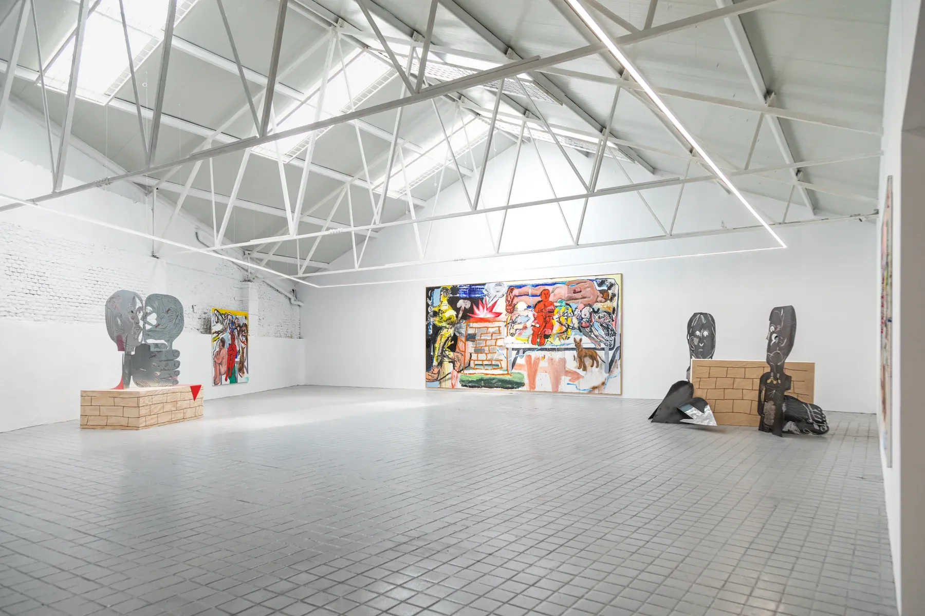 Wide installation view of Dog Bed Games by Manuel García Fernández, showing large paintings and sculptural works at Marc Bibiloni Gallery, Madrid, 2025.