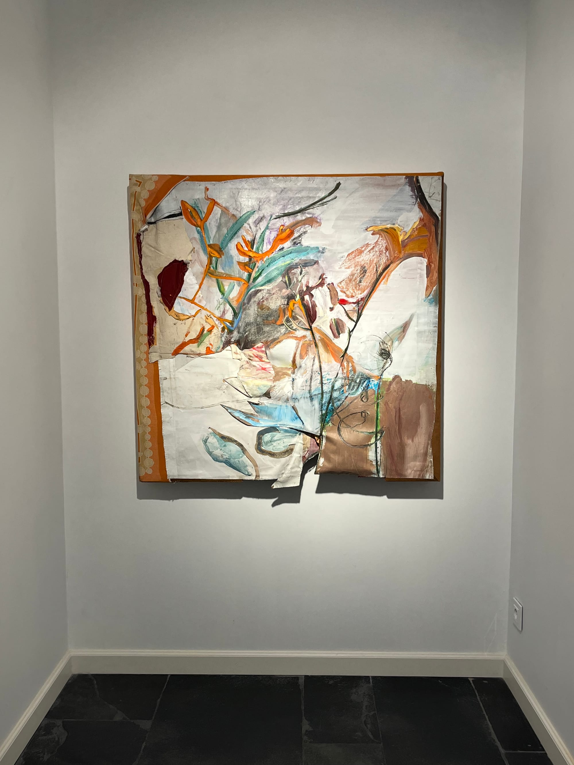 Ruth Devriendt’s 2021 work Sea Buckthorn, acrylic and biester on canvas, displayed on a white gallery wall above dark stone flooring. Image courtesy of the artist.