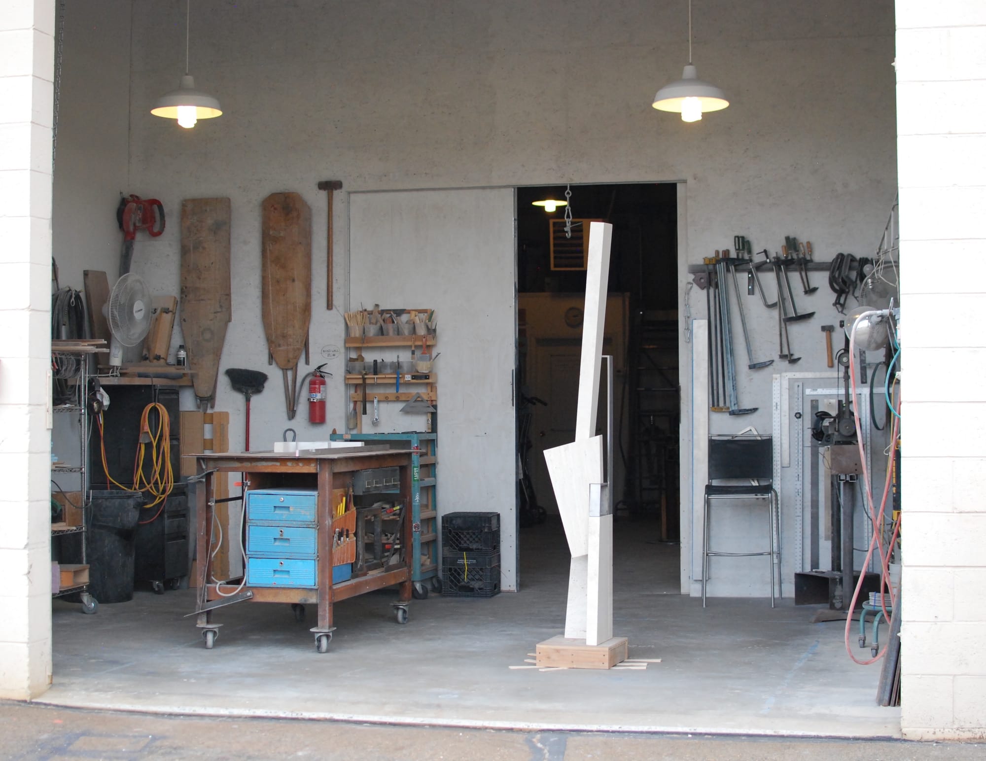 Chris Cassimatis’s sculpture studio in Salt Lake City in 2018, showing tools, work tables and a tall stone sculpture in progress near the entrance. Image Courtesy of the Artist.