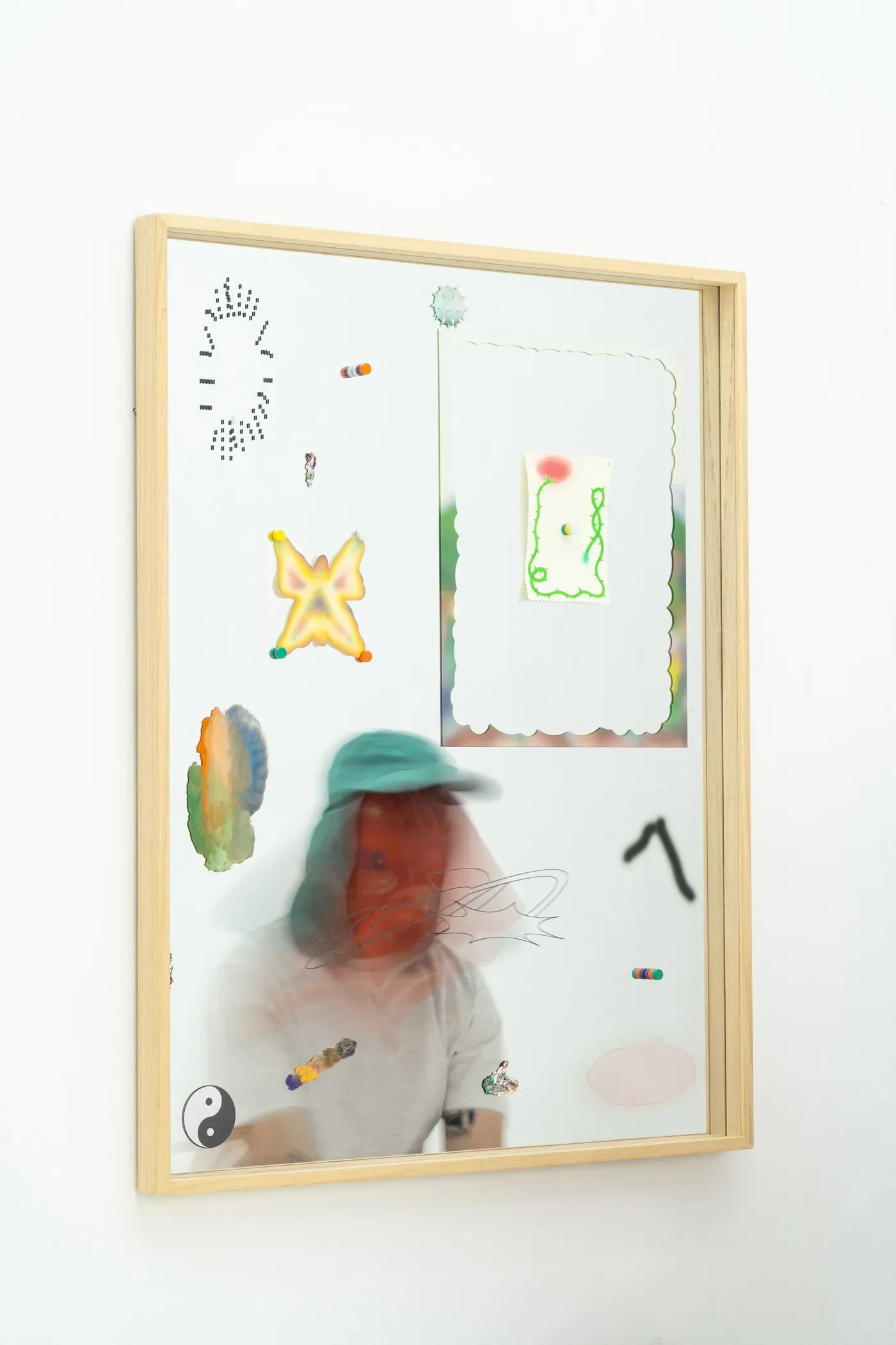grip face, artist -  mirror diary, artwork, with the artist as blurry manifestation, surrounded by little objects, paint, mirror, butterfly, works on paper