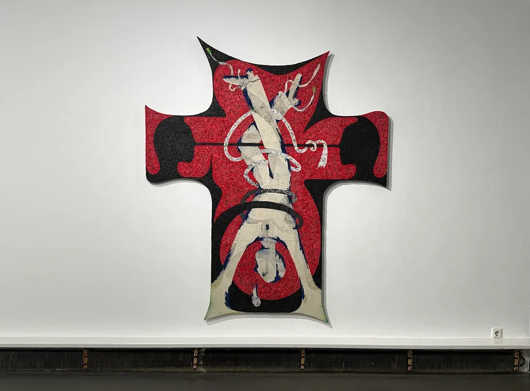 Parallel vienna - Bildrecht Award Winner Exhibition view of Egor Lovki’s large cross-shaped mosaic work at Bildraum 01, Vienna, featuring red, black, and white tones. Presented as part of the Friday Dispatch Vienna focus by Catapult