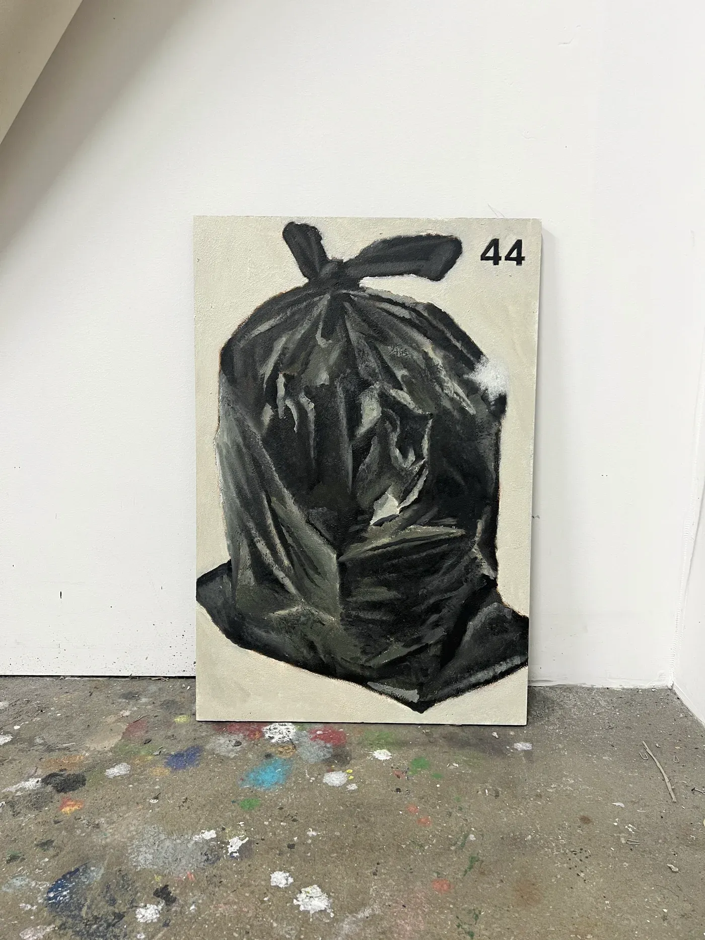 Painting of a tied black trash bag standing upright against a pale background, rendered with soft tonal brushwork.