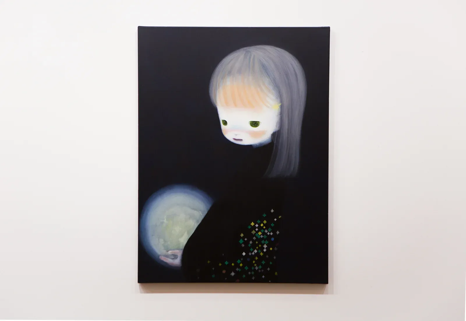 Installation view of a painting by Ruo-Hsin Wu shown at Tang Contemporary Art, featuring a pale figure emerging from a dark background within a group exhibition context.
