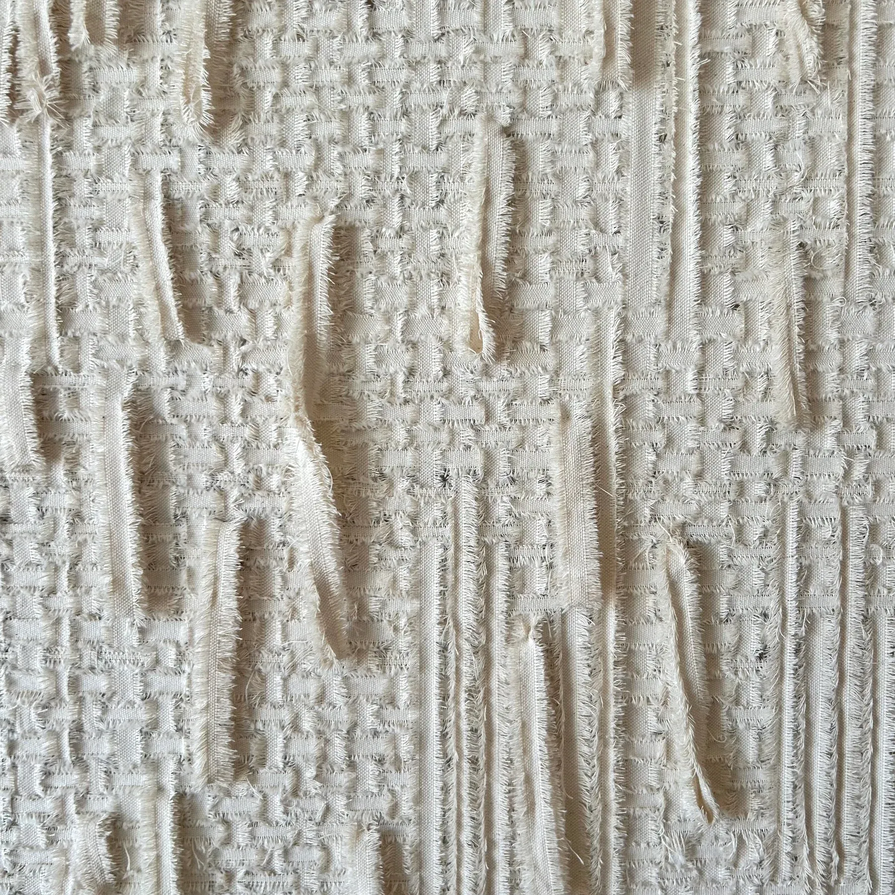 Detail of Avraam Hirodontis’ canvas-on-canvas work, revealing dense thread accumulation, tactile ridges, and fine material irregularities.