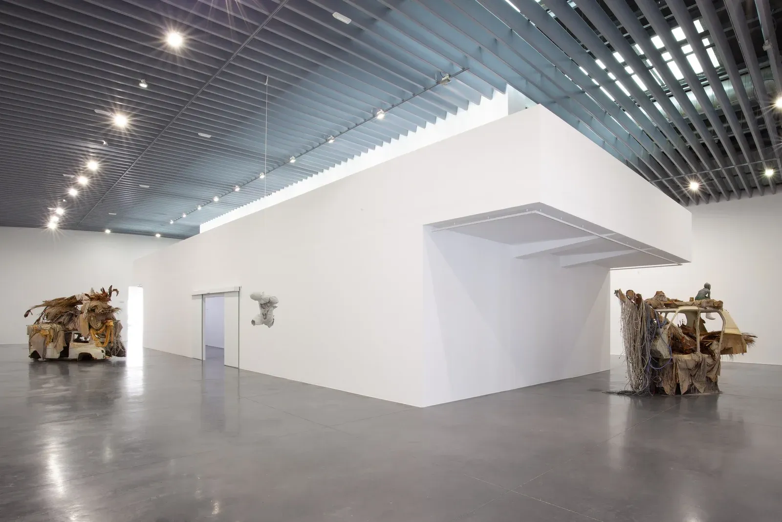 Installation view of Michele Gabriele’s mixed-media painting and sculptural structure at EACC Castellón, showing layered painterly surfaces within an architectural display.