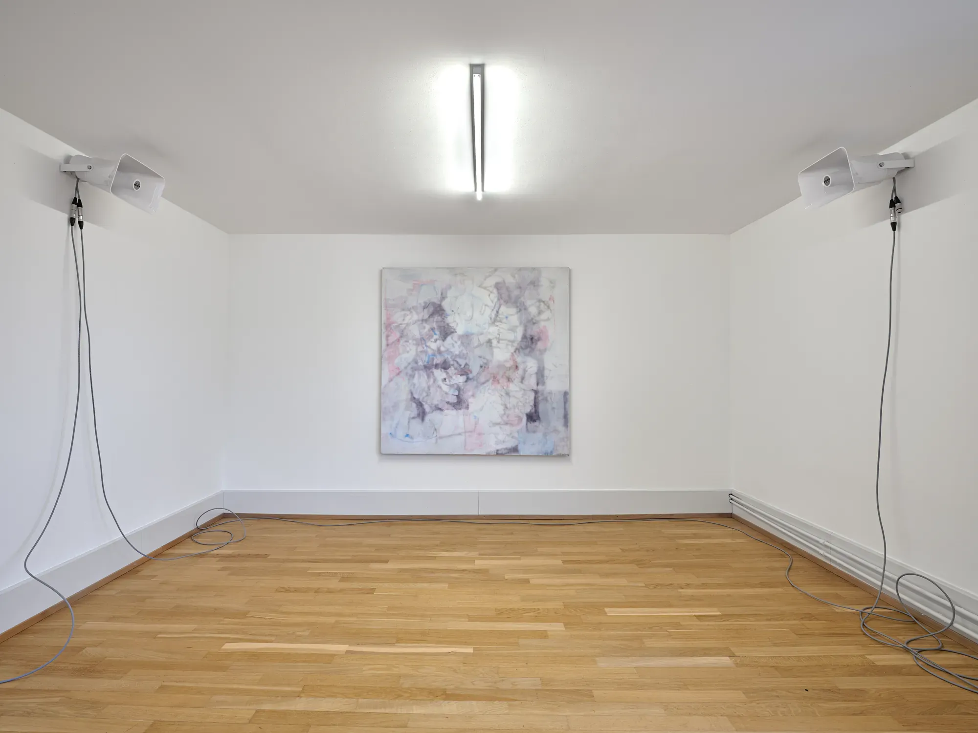 Painting by Anne-Lise Coste displayed between two wall-mounted speakers in the exhibition “Stitches: A Haunted House and Other Ghost Stories” at Villa Bernasconi, 2026.