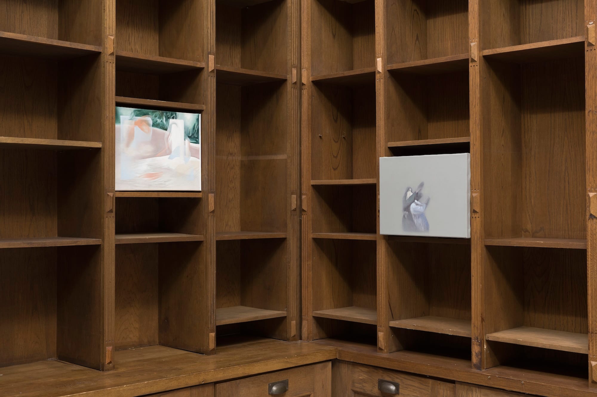 Installation view of a painting by Bora Baboçi displayed inside wooden shelving in the exhibition Bitter Spring at MARA Projects, London.