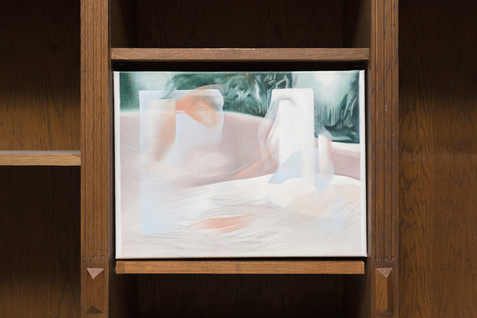 Painting by Bora Baboçi in a wooden shelving installation, shown in the group exhibition Bitter Spring at MARA Projects, London.