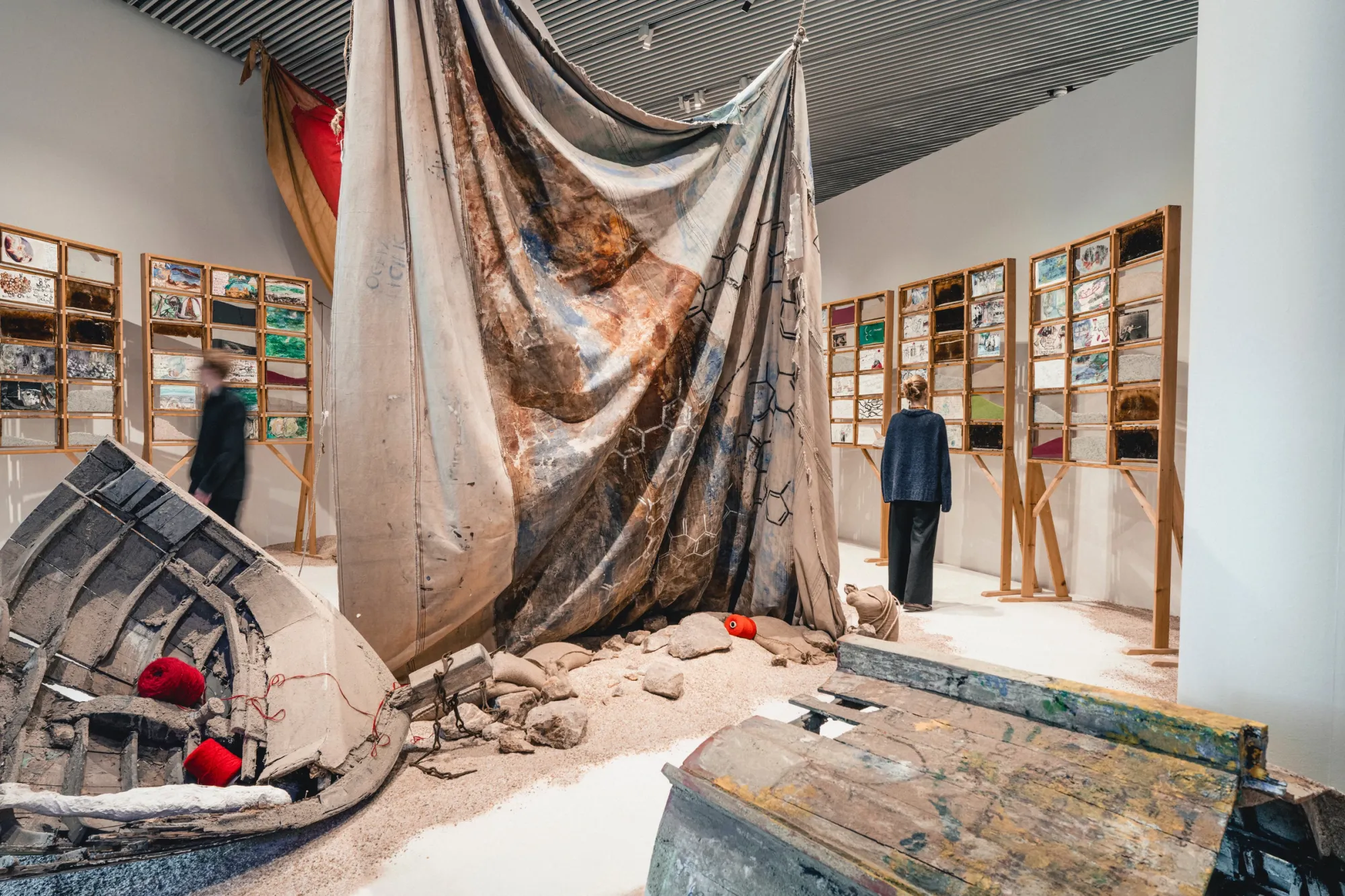 Anna Boghiguian The Sunken Boat: A Glimpse into Past Histories, 2025 Papier-mâché, glass, sand, cut paper, encaustic painting on Khadi paper, sound (recordings from Alexandria, Margate, Aarhus Bay), wall mural (destroyed at close of exhibition) Co-commissioned by ARoS Aarhus Kunstmuseum and Turner Contemporary