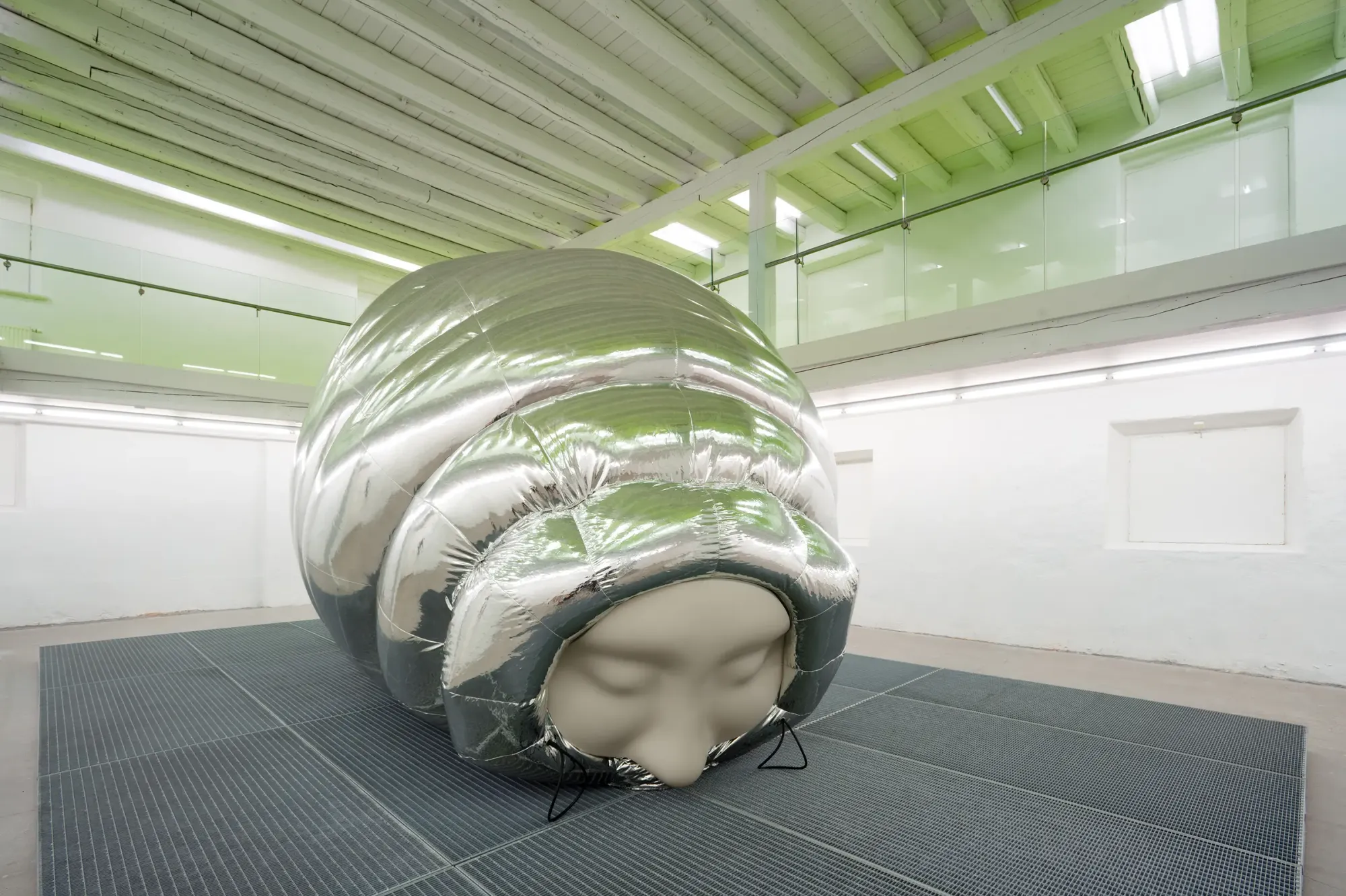Stine Deja Micro Management Viborg Kunsthal 2026 inflatable silver cocoon sculpture human face embedded contemporary art Denmark installation view