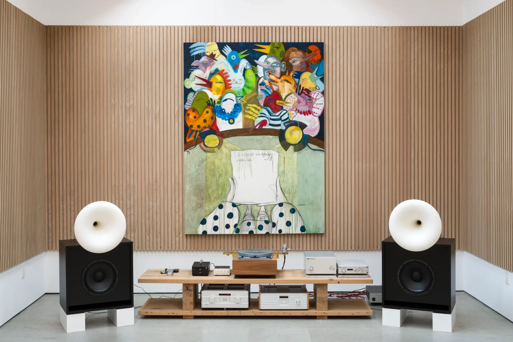 Installation view of Dinner Table at Simchowitz Hilltop, Los Angeles, showing a large figurative painting by Andrey Samarin centered above a turntable and speakers.
