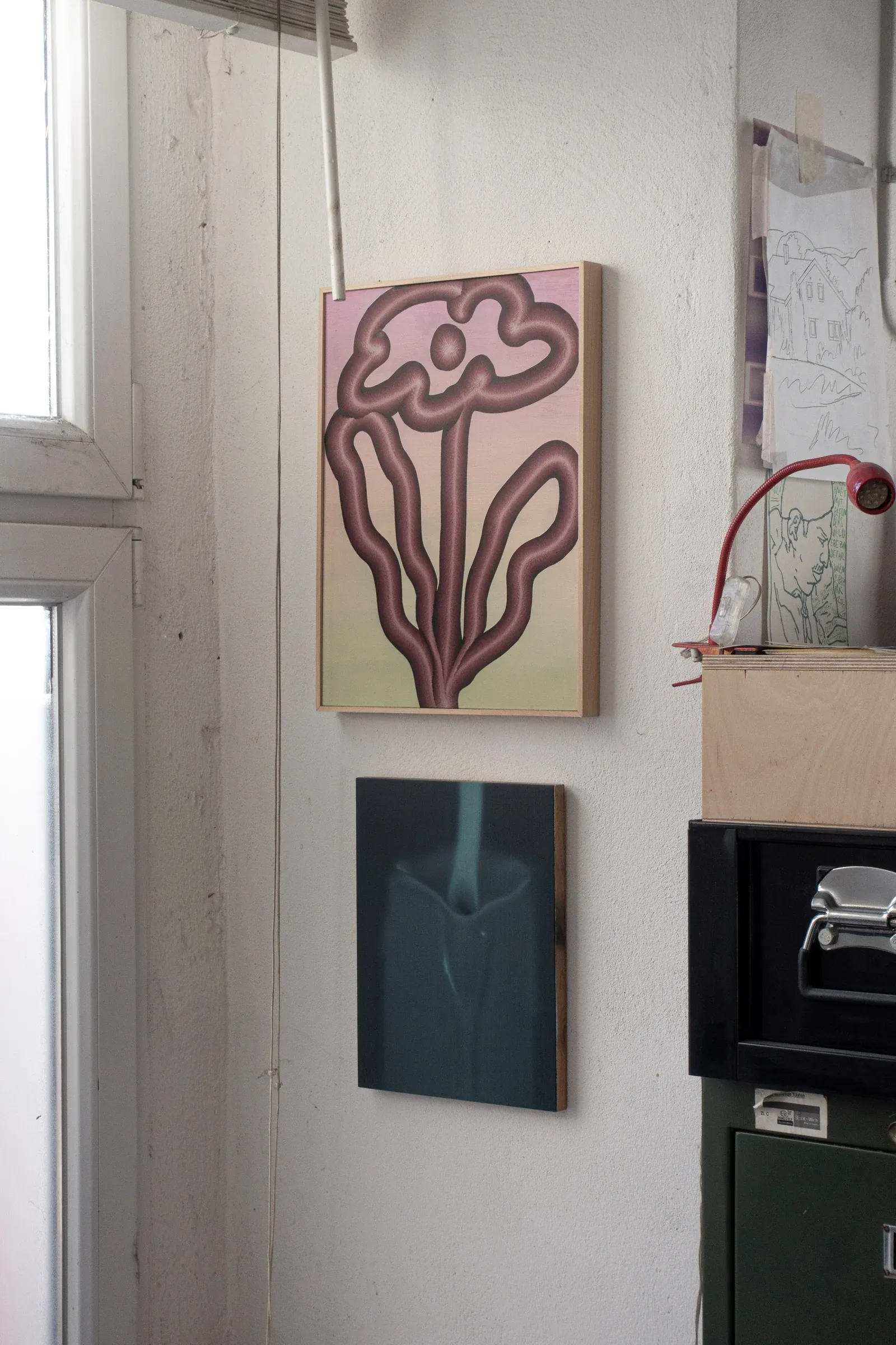 Studio view of paintings by Paul Riedmüller in Vienna showing abstract organic forms on canvas in a domestic workspace setting