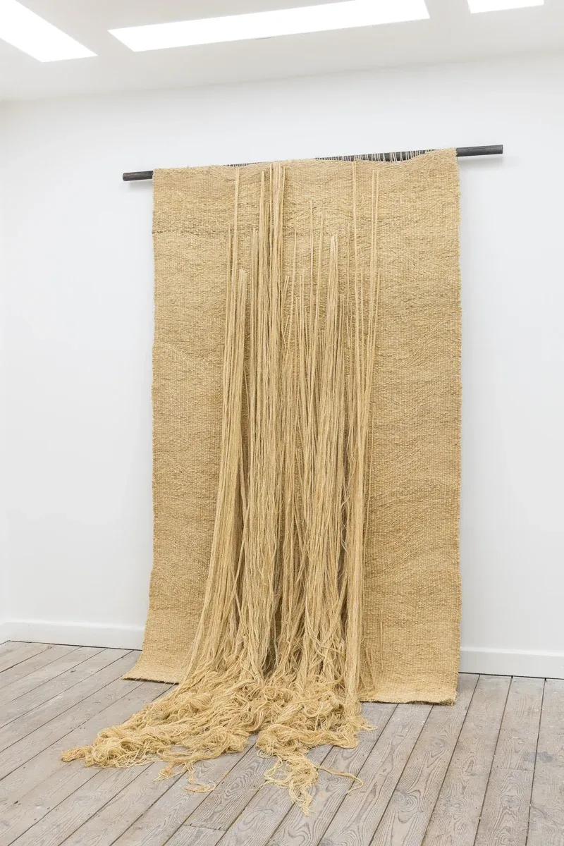 Soojin Kang red textile sculpture on gallery wall