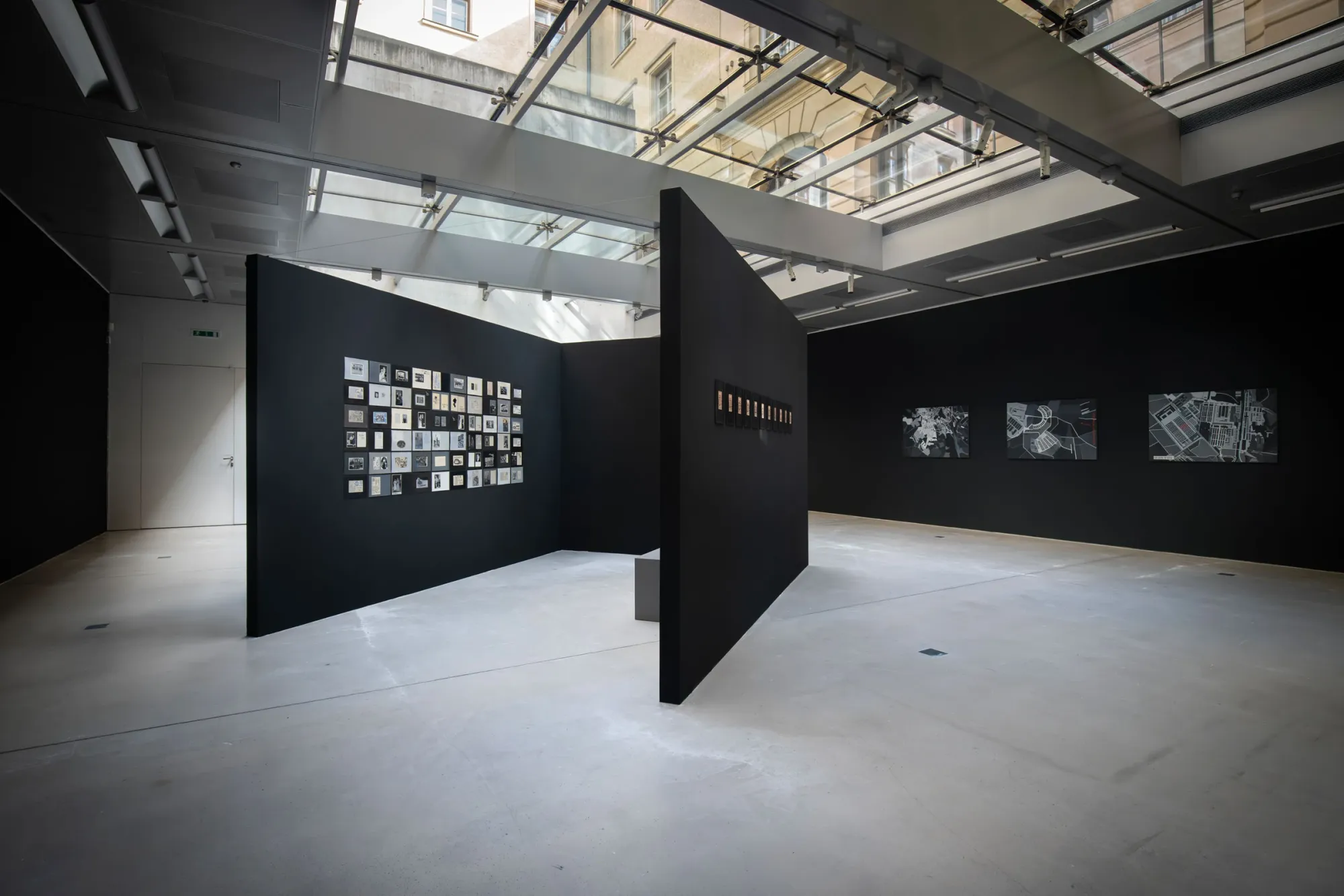 Ramesch Daha Mein Österreich exhibition view black walls installation TAXISPALAIS Innsbruck archive works