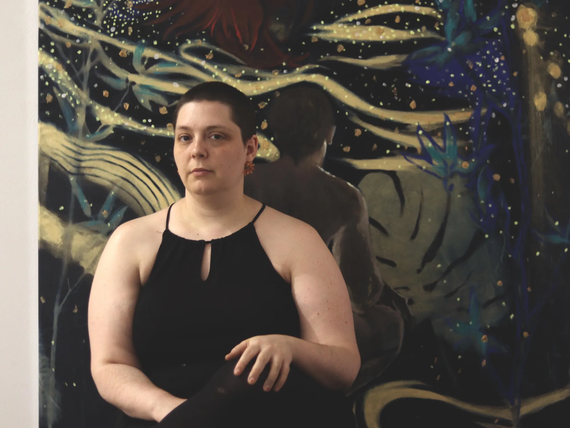 Candy Bassas, Berlin-based contemporary figurative painter, portrait in front of her nocturnal canvas with water and light motifs.