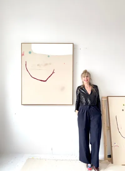 Christina gschwantner with painting as a moment of relief in artist in focus catapult munchies art club artist in her studio